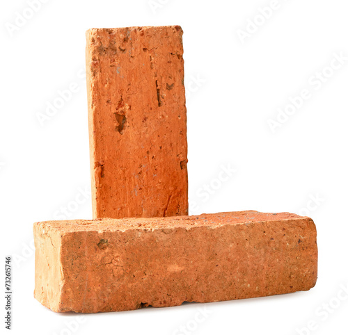 Front view of old cracked red or orange bricks in stack isolated with clipping path and shadow in png file format