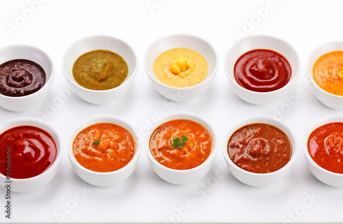 Delicious sauces on white background
