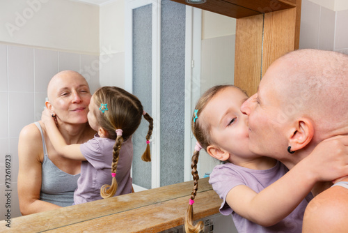Mom with cancer and child share kiss help to challenge illness