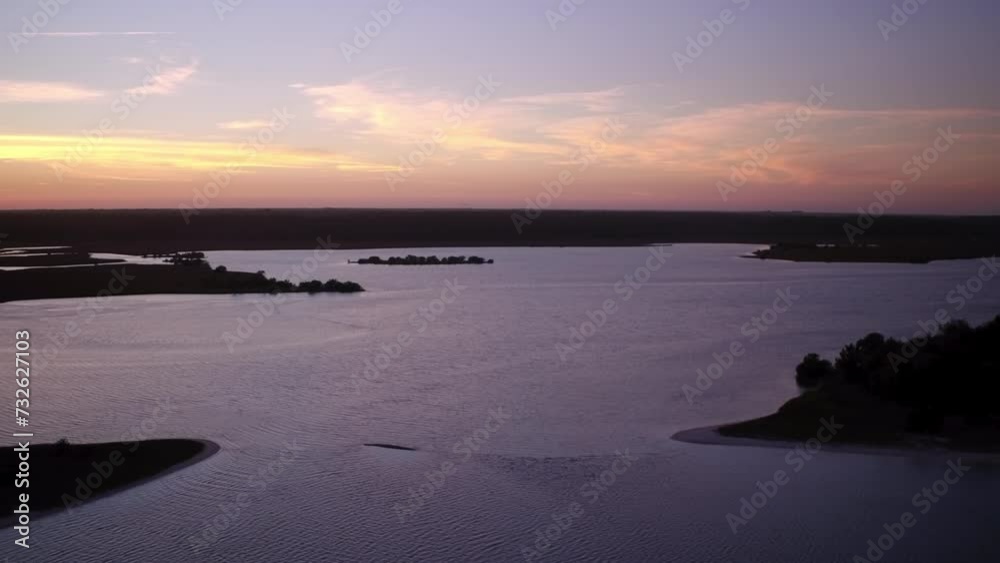 Aerial Panning Idyllic Shot Of Tranquil Rippled Lake Against Orange Sky At Sunset - Daytona Beach , Florida Aerial Panning Idyllic Shot Of Tranquil Rippled Lake Against Orange Sky At Sunset - Daytona Beach , Florida