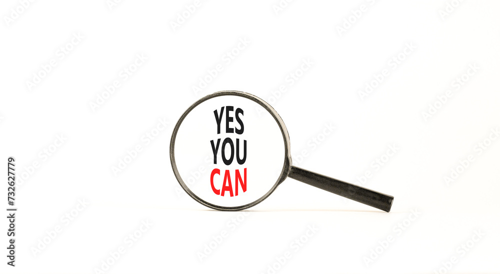 Motivational Yes you can symbol. Concept words Yes you can in beautiful magnifying glass. Beautiful white table white background. Business motivational and Yes you can concept. Copy space Motivational Yes you can symbol. Concept words Yes you can in beautiful magnifying glass. Beautiful white table white background. Business motivational and Yes you can concept. Copy space
