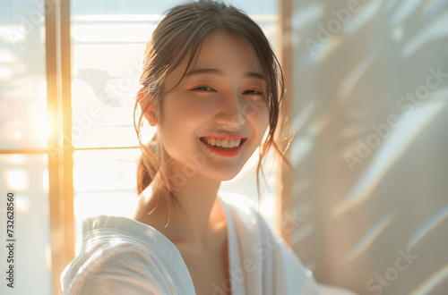 young girl in a white robe smiling and smiling