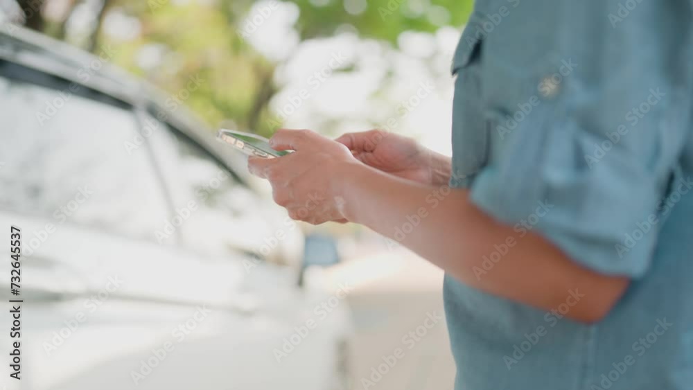 Woman uses the phone to call an insurance agent because of an accident or car breakdown. and searching for car repair shops while touring the countryside. Notify the insurance company through the appl Woman uses the phone to call an insurance agent because of an accident or car breakdown. and searching for car repair shops while touring the countryside. Notify the insurance company through the appl
