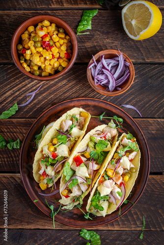 Mexican tacos with chicken meat, corn and salsa. Healthy tacos. Diet menu. Mexican taco. Top view, flat lay