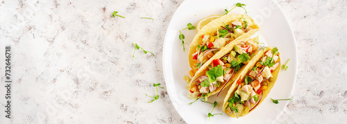 Mexican tacos with chicken meat, corn and salsa. Healthy tacos. Diet menu. Mexican taco. Top view, flat lay