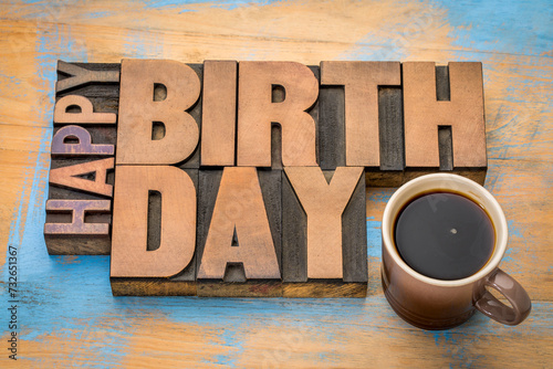 Happy Birthday greeting card - word abstract in vintage letterpress wood type blocks with a cup of coffee