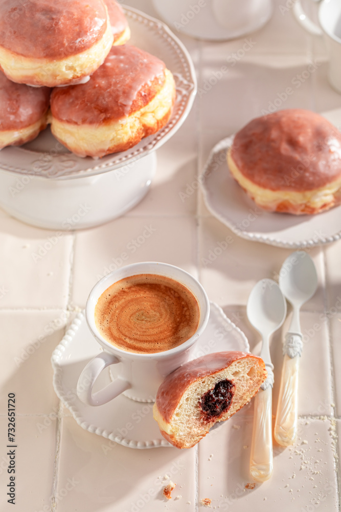 Traditionally and homemade doughnuts deep frying in oil. Traditionally and homemade doughnuts deep frying in oil.