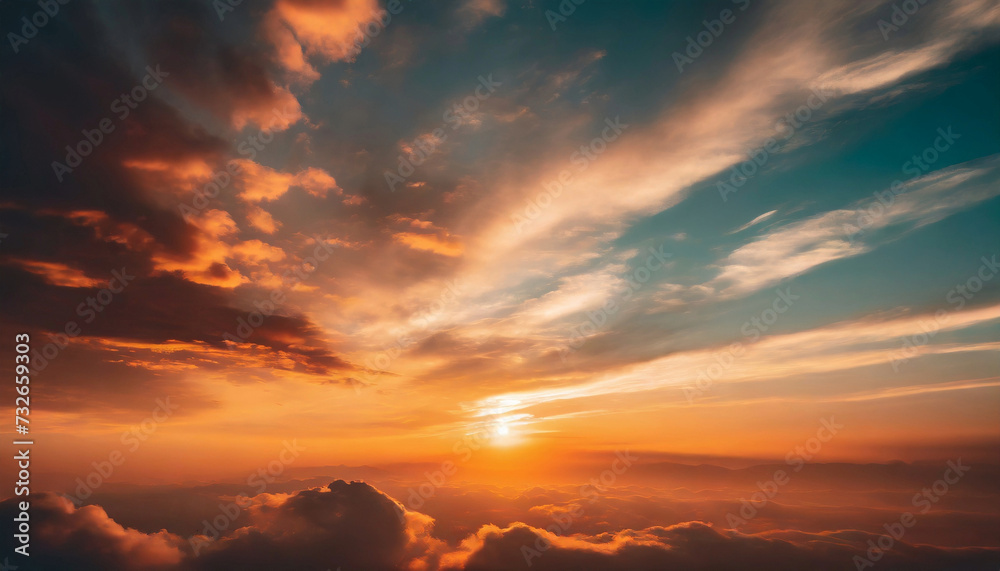 Obraz premium Beautiful sunset sky above the fluffy clouds illuminated in vibrant colors. Natural summer cloudscape