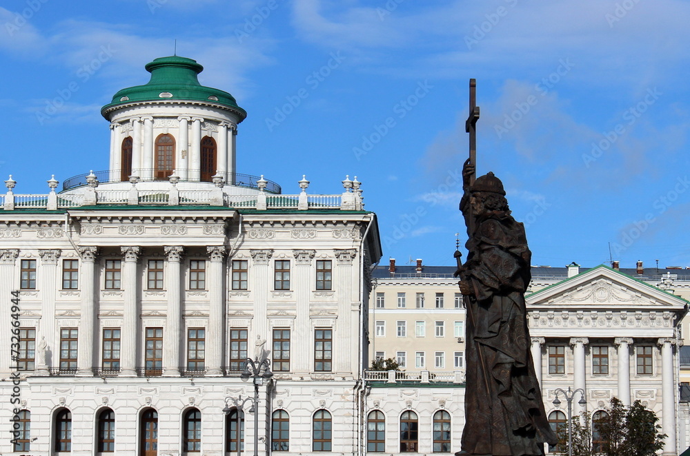 Moscow. Russia. Monument to Grand Duke Vladimir Svyatoslavovich the Baptist of Russia against the background of the historical building of the Pashkov House. 