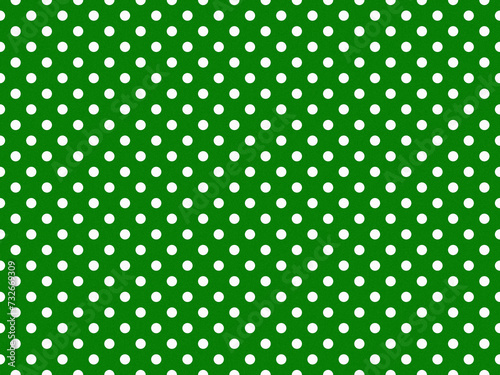 texturised white color polka dots over green background