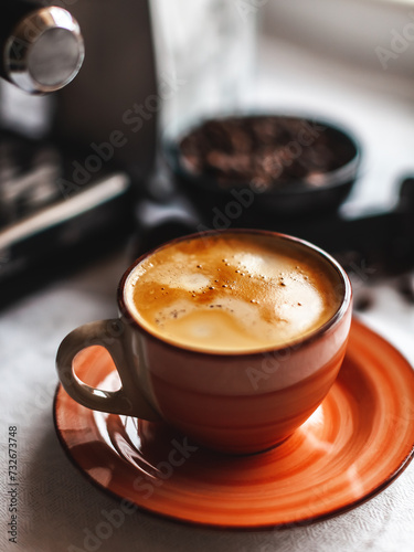 a cup of morning espresso from the coffee machine, good coffee with a thick foam cream