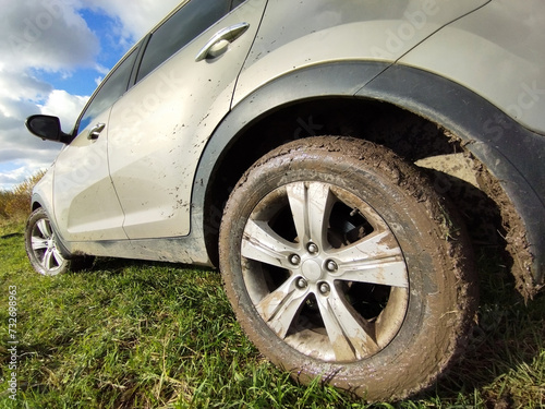 close-up of dirty wheels of an off-road car in the mud