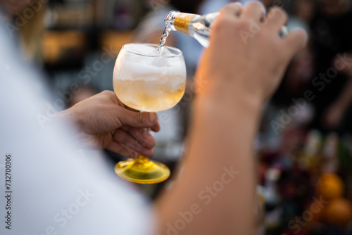 holding cool fresh alcoholic cocktail in hands at party