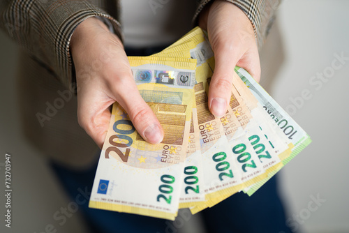 business lady holds euro bills in her hands