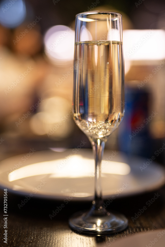 a glass of champagne on the festive table