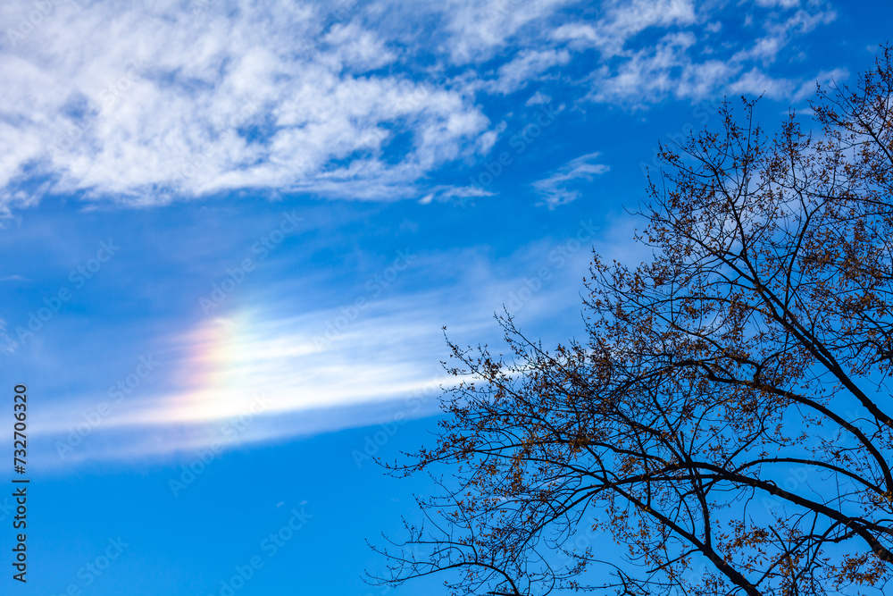 Rainbow in the sky in white clouds, natural phenomenon in the sky over New Jersey