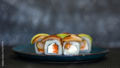 Sushi rolls are served on a plate. soy sauce. Delicious seafood food.