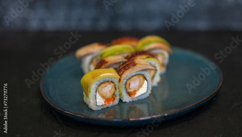Sushi rolls are served on a plate. soy sauce. Delicious seafood food.