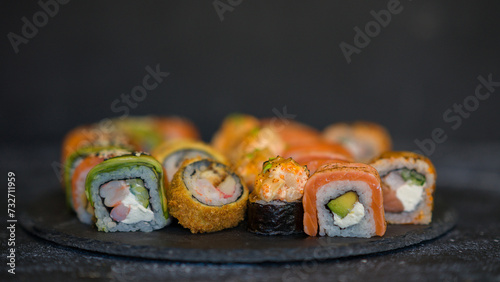 Sushi rolls are served on a plate. soy sauce. Delicious seafood food.
