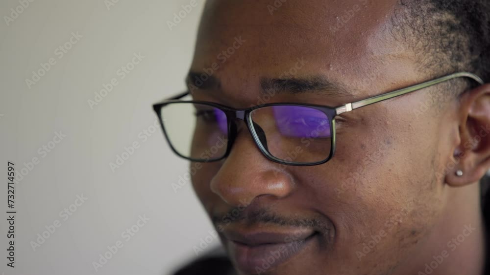 Close up portrait of young african american man student with glasses writer sit at home office desk with laptop thinking of inspiration search problem solution ideas lost in thoughts concept Close up portrait of young african american man student with glasses writer sit at home office desk with laptop thinking of inspiration search problem solution ideas lost in thoughts concept