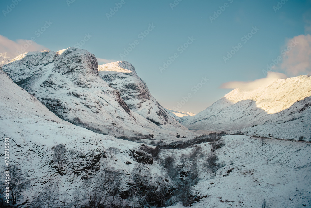 Two snow-covered peaks of the Three Sisters mountains in Glencoe, Scottish highlands