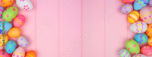 Colorful Easter Egg double border over a soft pink wood banner background. Copy space.