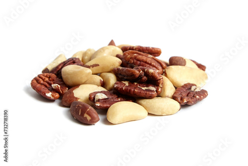 Brazil nuts and peeled pecans mix isolated on white background. Wholesome variety of nuts in a heap