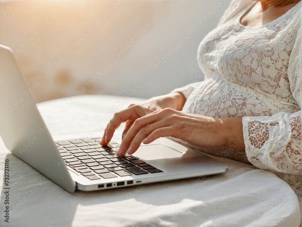 Woman on laptop with big belly advanced pregnancy on white background  - obrazy, fototapety, plakaty 