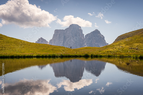 Lago Delle Baste reflecting all the clouds, Italy, Dolomites photo