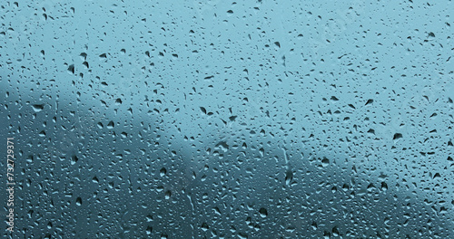 Rain drops closeup on home glass window. 