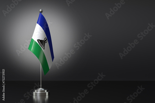 Small National Flag of the Kingdom of Lesotho on a Black Background. 3d Rendering photo