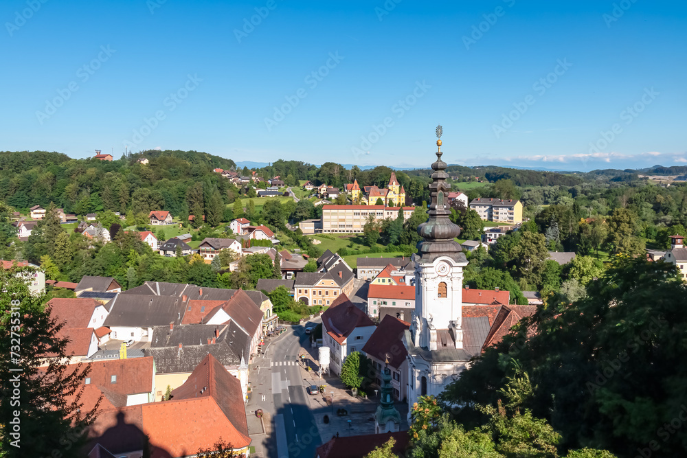 Panoramic aerial view of Ehrenhausen town with the clock tower of the Catholic pilgrimage church in foreground, Leibnitz, south Styria, Austria. Well known wine region in South West Styria