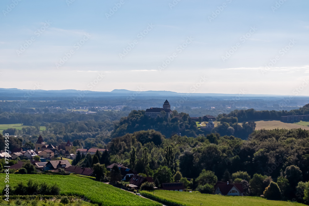 Scenic view from Weinleiten water tower in Ehrenhausen an der Weinstrasse (wine road), Leibnitz, South Styria, Austria. Wine plantations and vineyards stretching over lush green hills. Styrian Tuscany