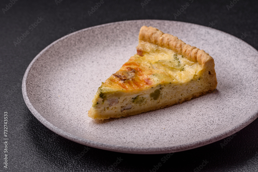 Delicious crispy quiche cut into slices with cheese, broccoli, tomatoes Delicious crispy quiche cut into slices with cheese, broccoli, tomatoes
