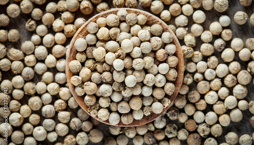 White peppercorns background  top view. Close up of a background of white peppercorns