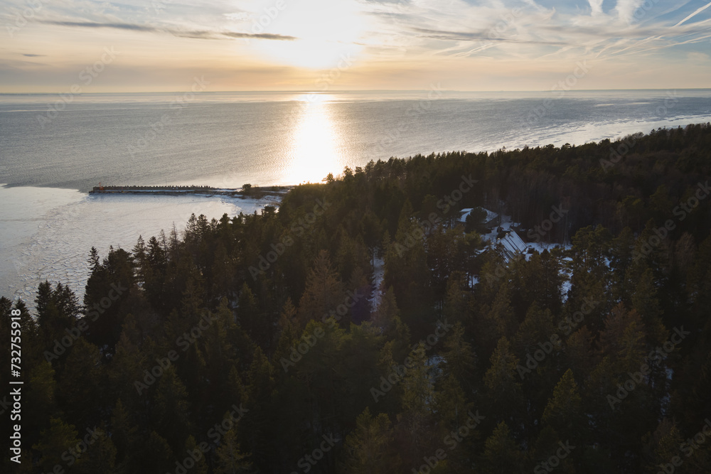 A pier and forest on the island of Aegna on a winter day, photo from a drone.