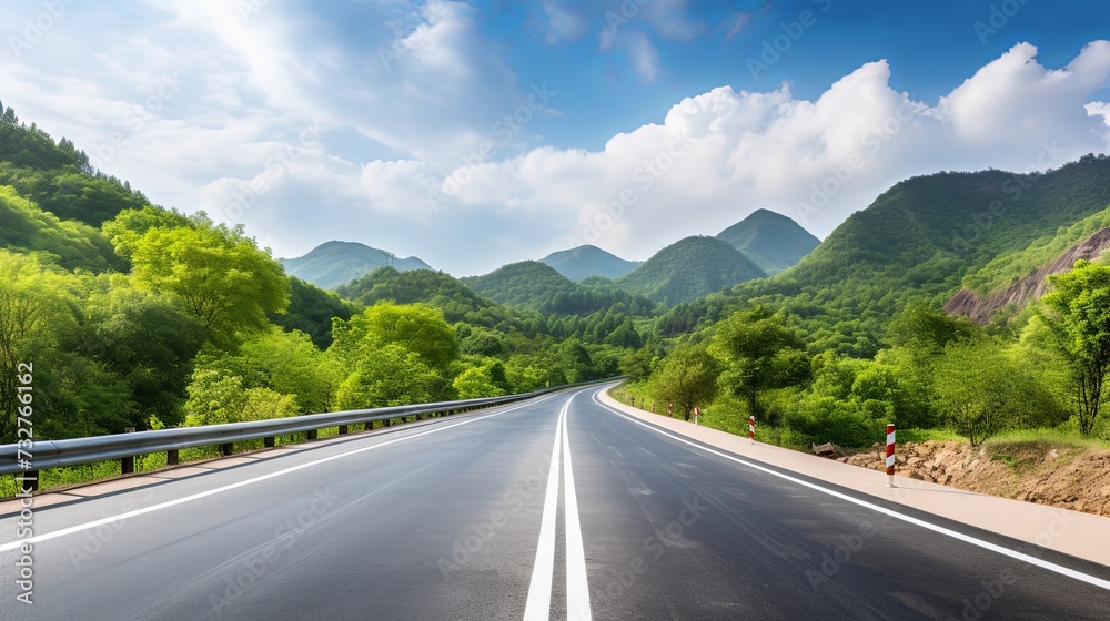 Asphalt road and green forest with mountain nature landscape in Hangzhou, China.