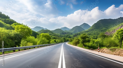 Asphalt road and green forest with mountain nature landscape in Hangzhou, China. © chanidapa