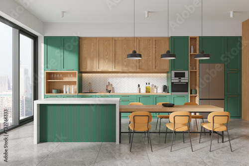 Green and wooden kitchen interior with island © ImageFlow