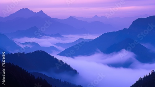 Mountain ranges in mist at twilight, purple hues