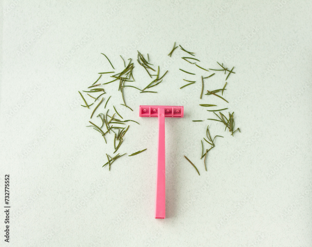 Fototapeta premium pink razor with needle needles, concept of shaving, hair removal