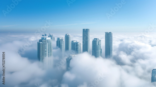 Panoramic view of the city in the clouds. Skyscrapers in the fog.