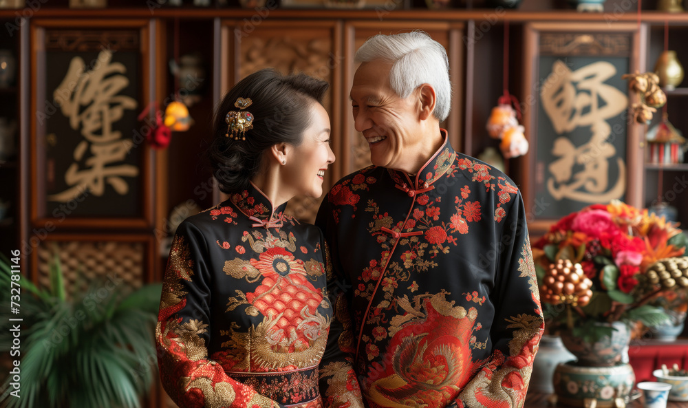 Happy senior couple in elaborate traditional Chinese dress, sharing a tender moment in a room adorned with cultural decorations.. Happy senior couple in elaborate traditional Chinese dress, sharing a tender moment in a room adorned with cultural decorations..