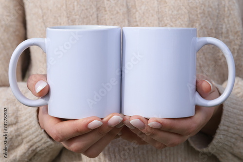 hands holding  two cups