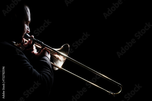 Trombone player. Trombonist playing brass instrument