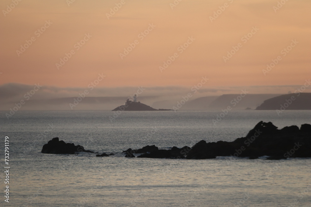 godrevy lighthouse st ives in mystic fog at sunrise
