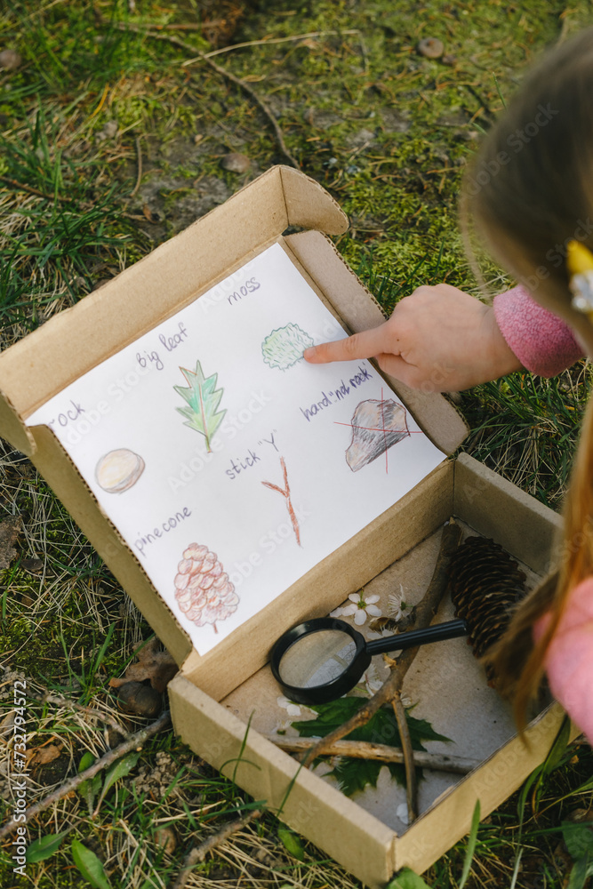 Scavenger hunt for kid in the park. Girl learning about environment ...