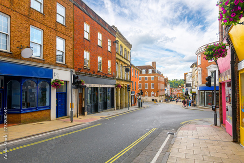 Picturesque half timber frame buildings full of shops and cafes on the popular and touristic High Street in the medieval old town of Winchester, England, UK. 