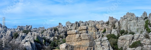 Hiking the Torcal de Antequerra National Park, limestone rock formations and known for unusual karst landforms in Andalusia, Malaga, Spain.