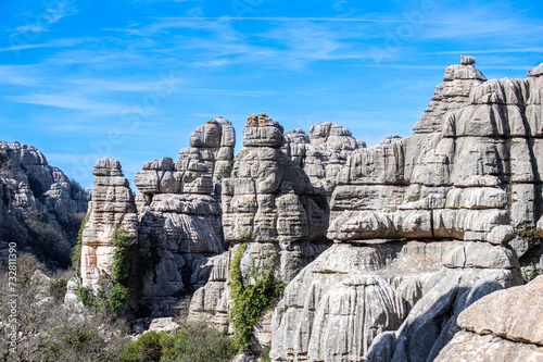 Hiking the Torcal de Antequerra National Park, limestone rock formations and known for unusual karst landforms in Andalusia, Malaga, Spain. © Vitali
